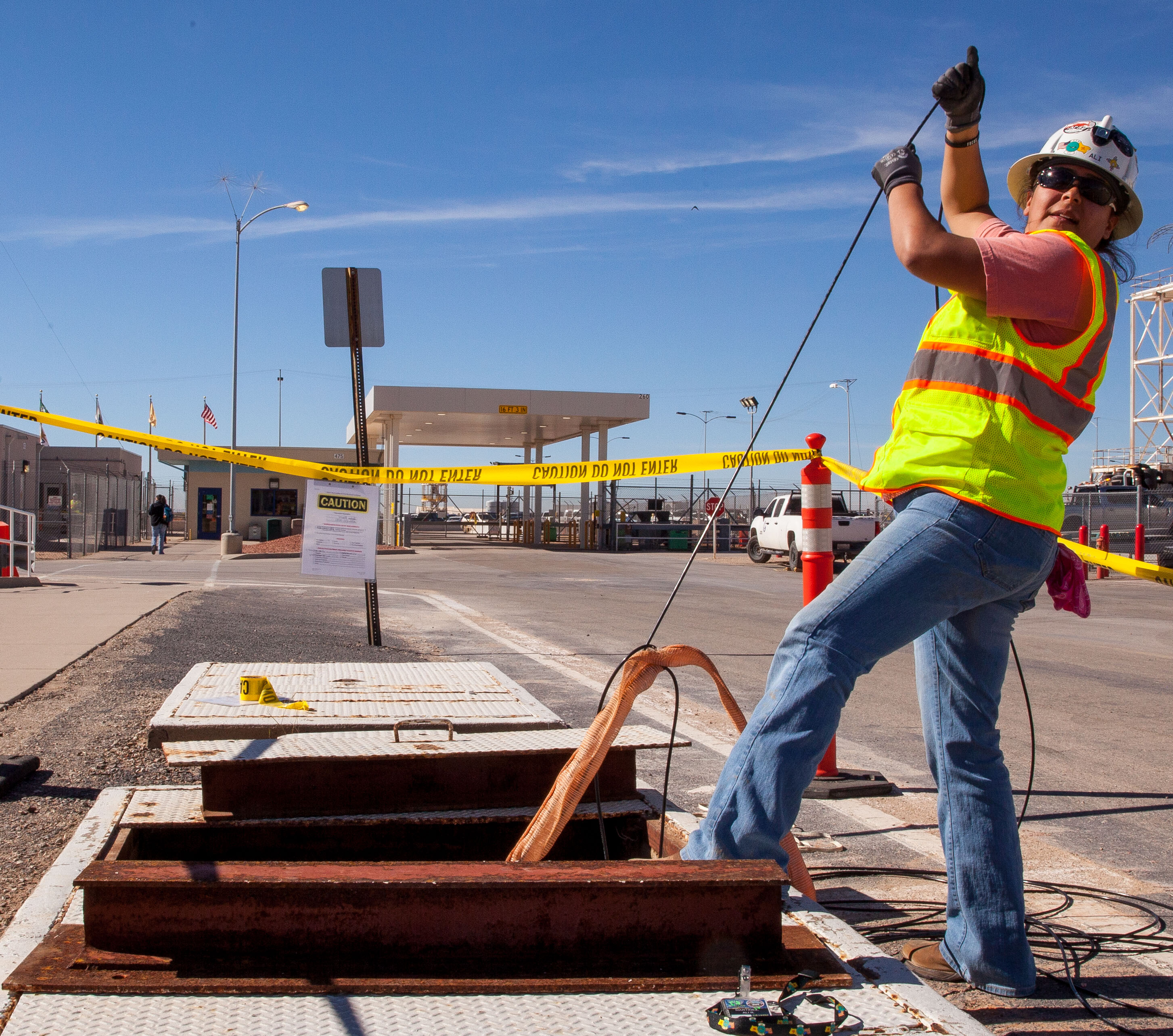 WIPP employee runs fiber-optic cable