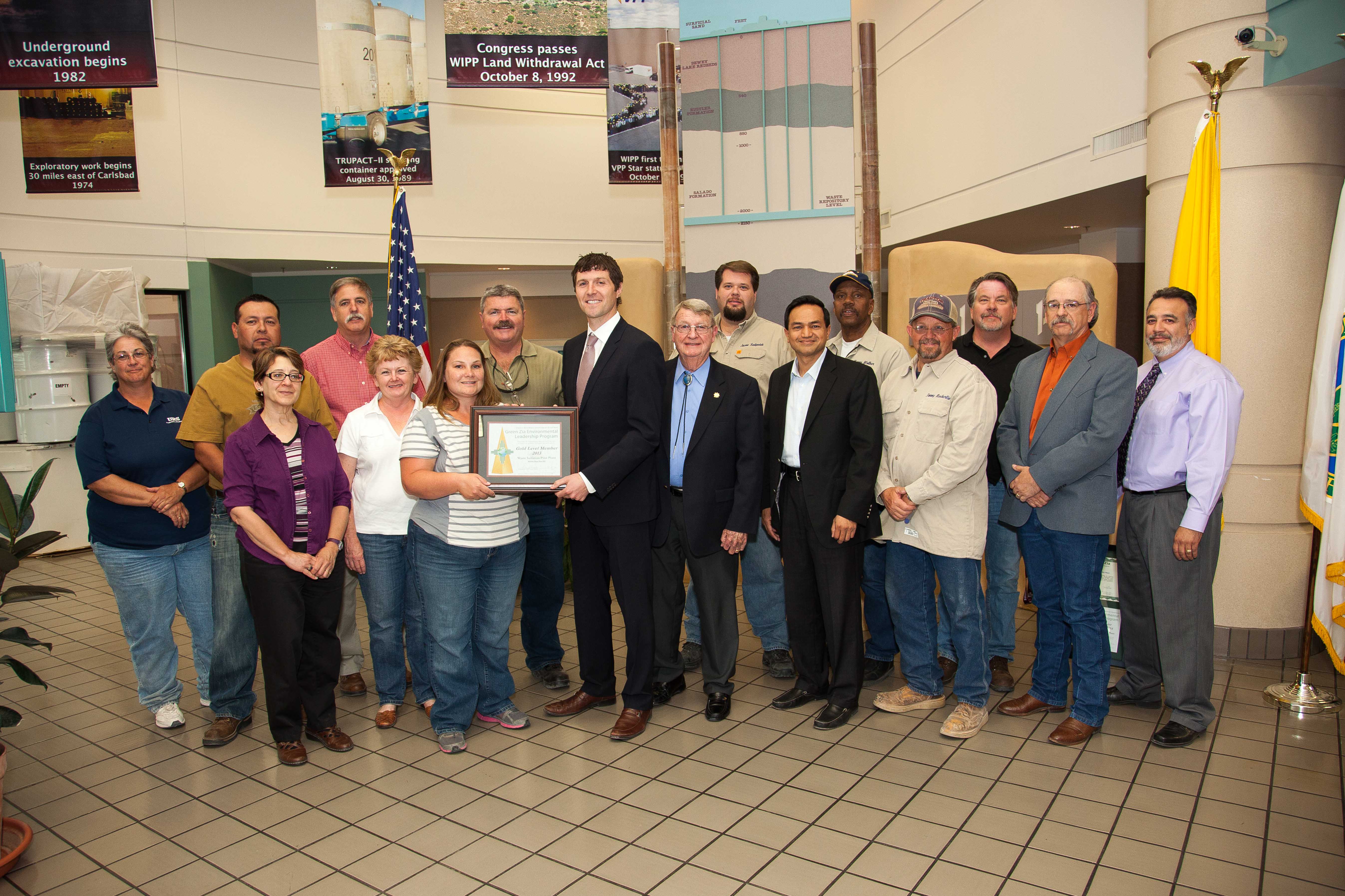 New Mexico Environment Department (NMED) Secretary Ryan Flynn recognizes the U.S. Department of Energys Waste Isolation Pilot Plant (WIPP) for environmental excellence.