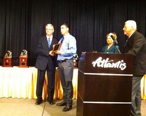 Waste Isolation Pilot Plant Blue Mine Rescue Team Captain Gary Kessler (right) receives an award from Neal Merrifield, administrator for the Mine Safety and Health Administration Metal/Non-Metal mines, after Kessler was inducted into the National Mine Rescue Hall of Fame on Aug. 1, 2013.